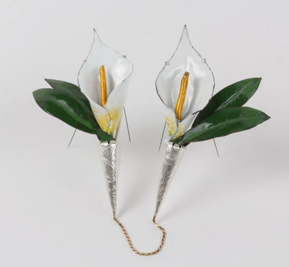 Enameled brooch with two three dimensional lilies connected by a gold chain titled "Intimacy" (Materials: copper, enamel, silver, 24k gold, steel pin stem; size: 7” x 5.5” x 1”; year: 2019)